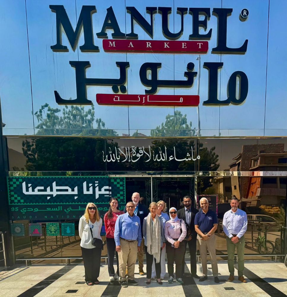 A group of people outside an exhibition hall in Saudi Arabia